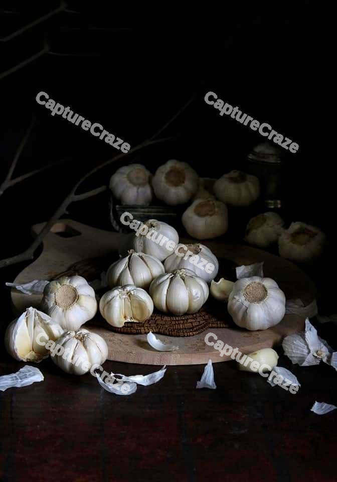 Garlic bulbs on a board